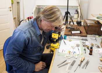 8Glenn checking bridge finishing with12x loupe